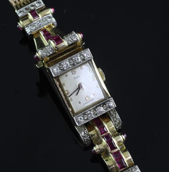 A ladys 1950s? gold, cabochon ruby and diamond set Frey cocktail watch, approx. 6.75in.